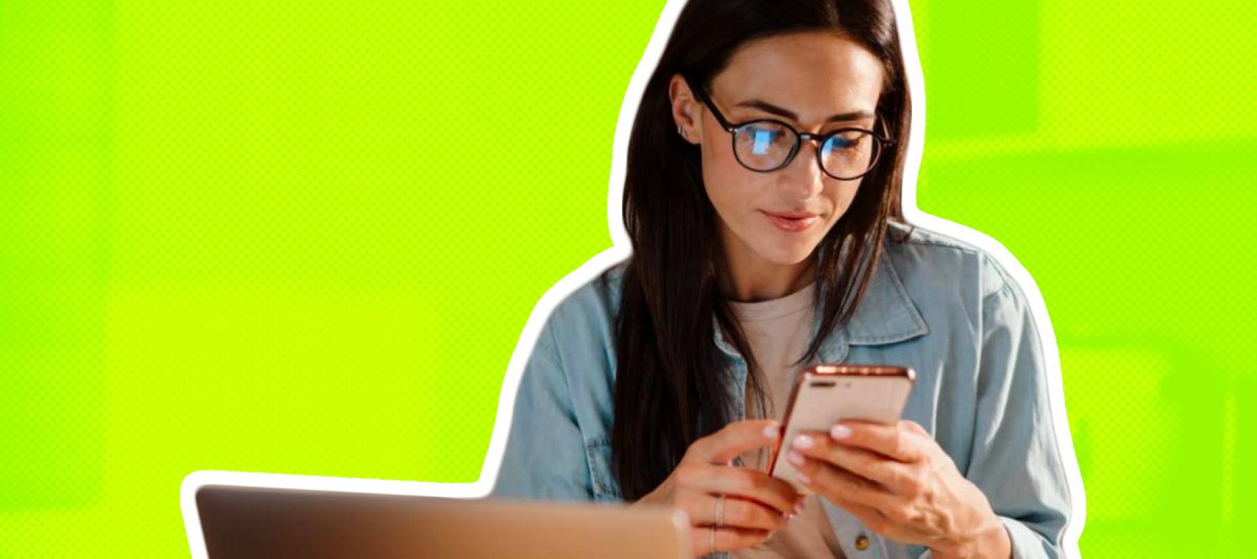 Young woman looking at her phone in the kitchen
