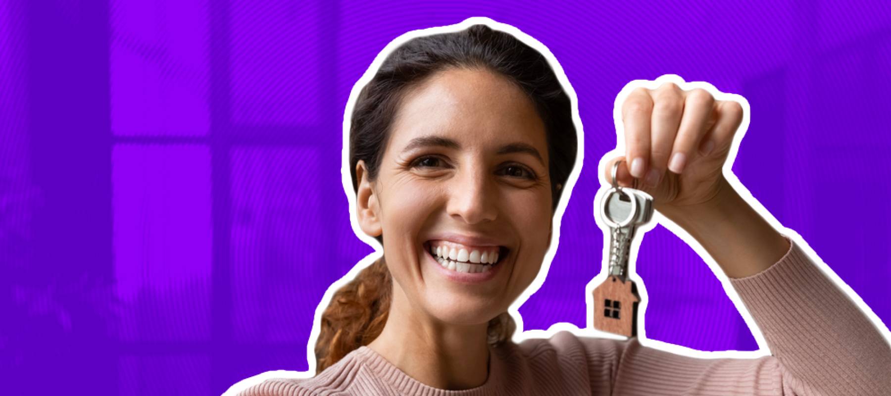 Excited young woman holds up a set of keys while taking a selfie.