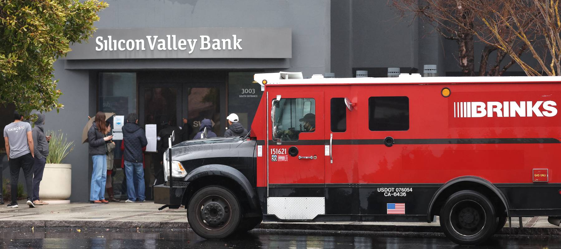 A Brinks armored truck sits parked in front of the shuttered Silicon Valley Bank (SVB) headquarters on March 10, 2023 in Santa Clara, California.