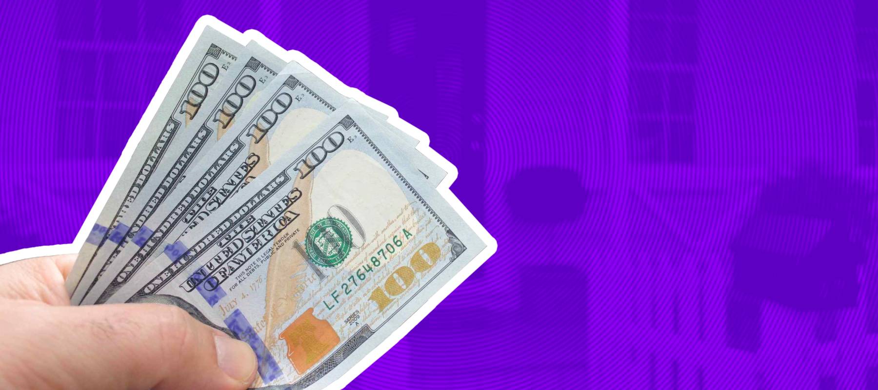 Man's hand holds Federal reserve US dollar notes against a front of a house. Buy, sale, real estate, insurance, mortgage, bank, home, loans and housing market concept. Copy space