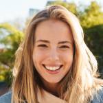 Woman smiles with credit card
