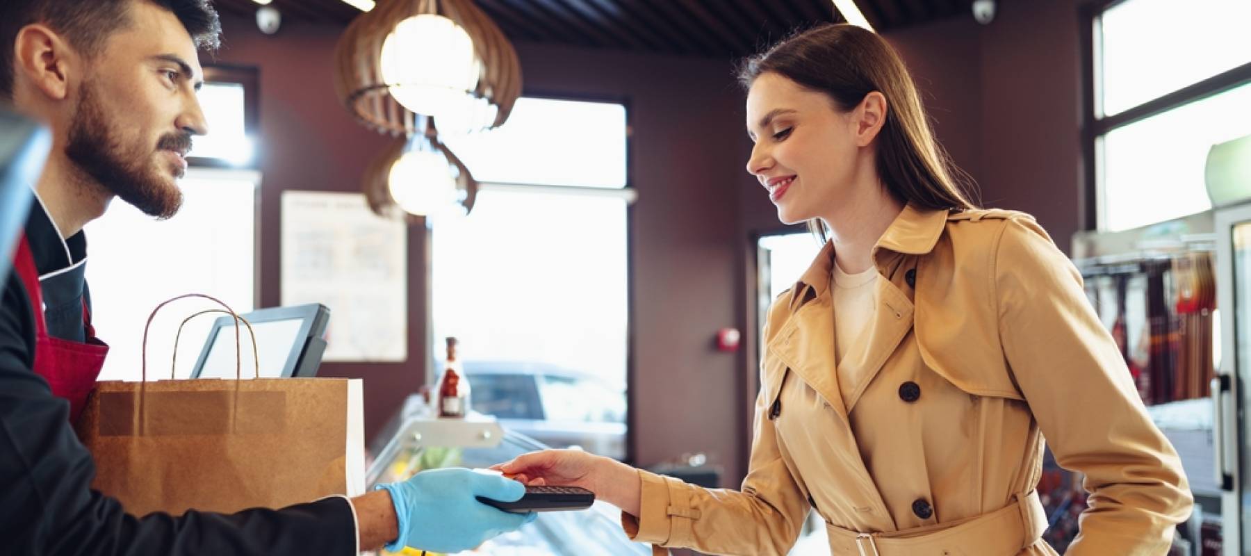 Woman pays by credit card