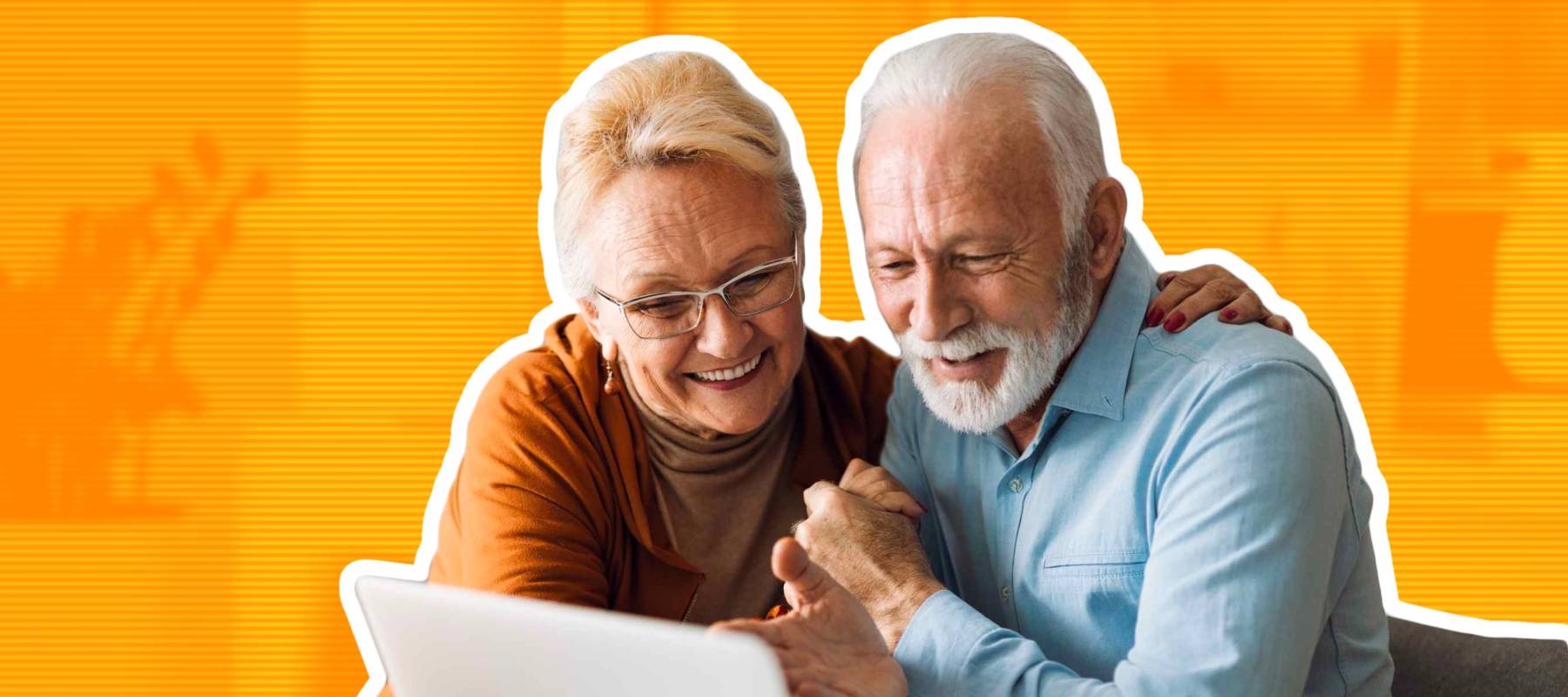 Embraced mature couple surfing the Internet on laptop at home