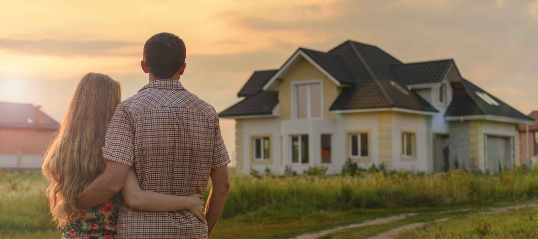 couple looking on house