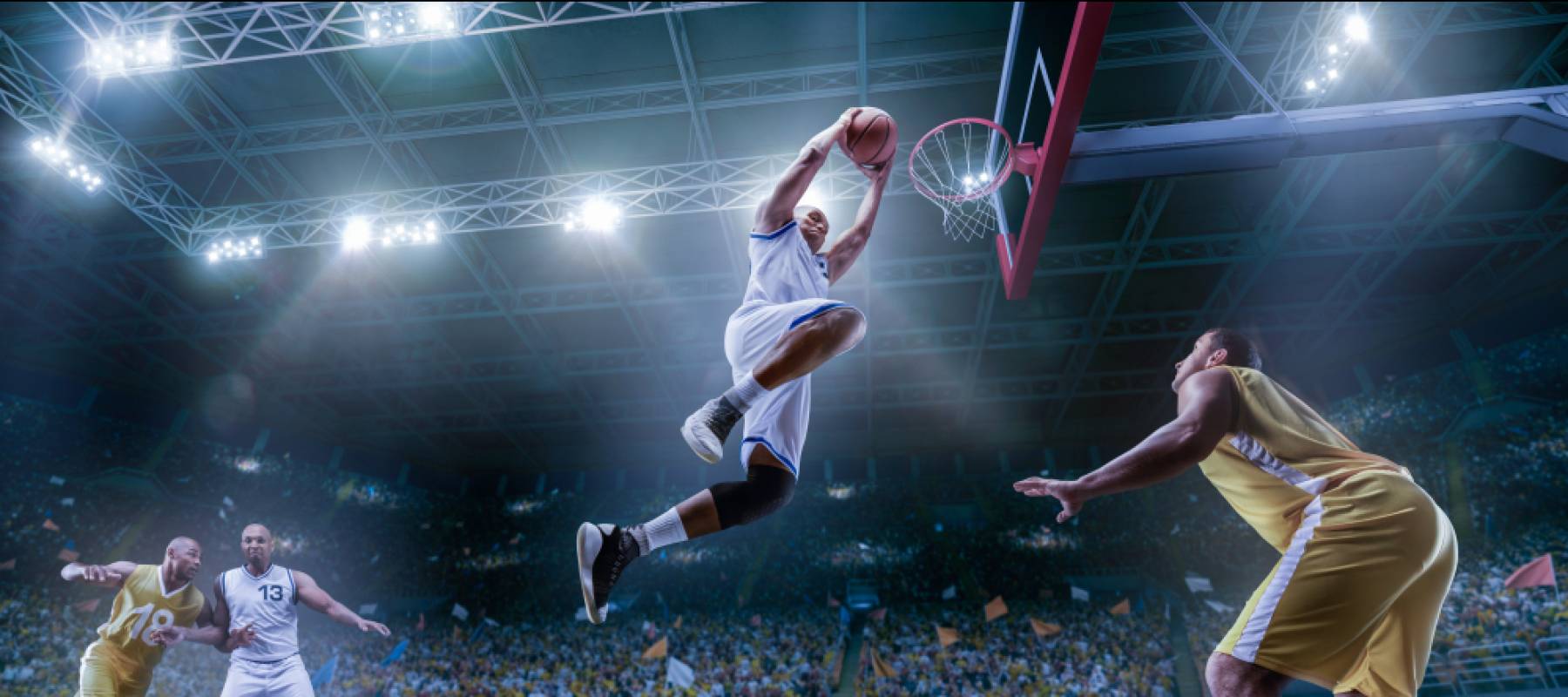 Basketball players on big professional arena during the game