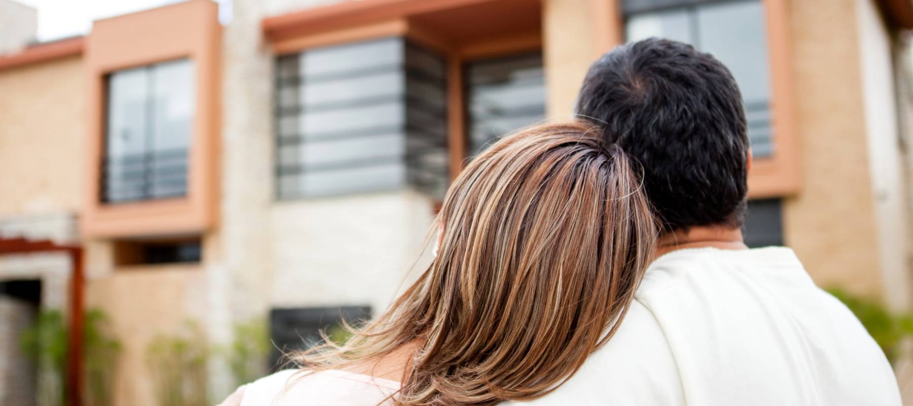 Loving couple looking at their dream house