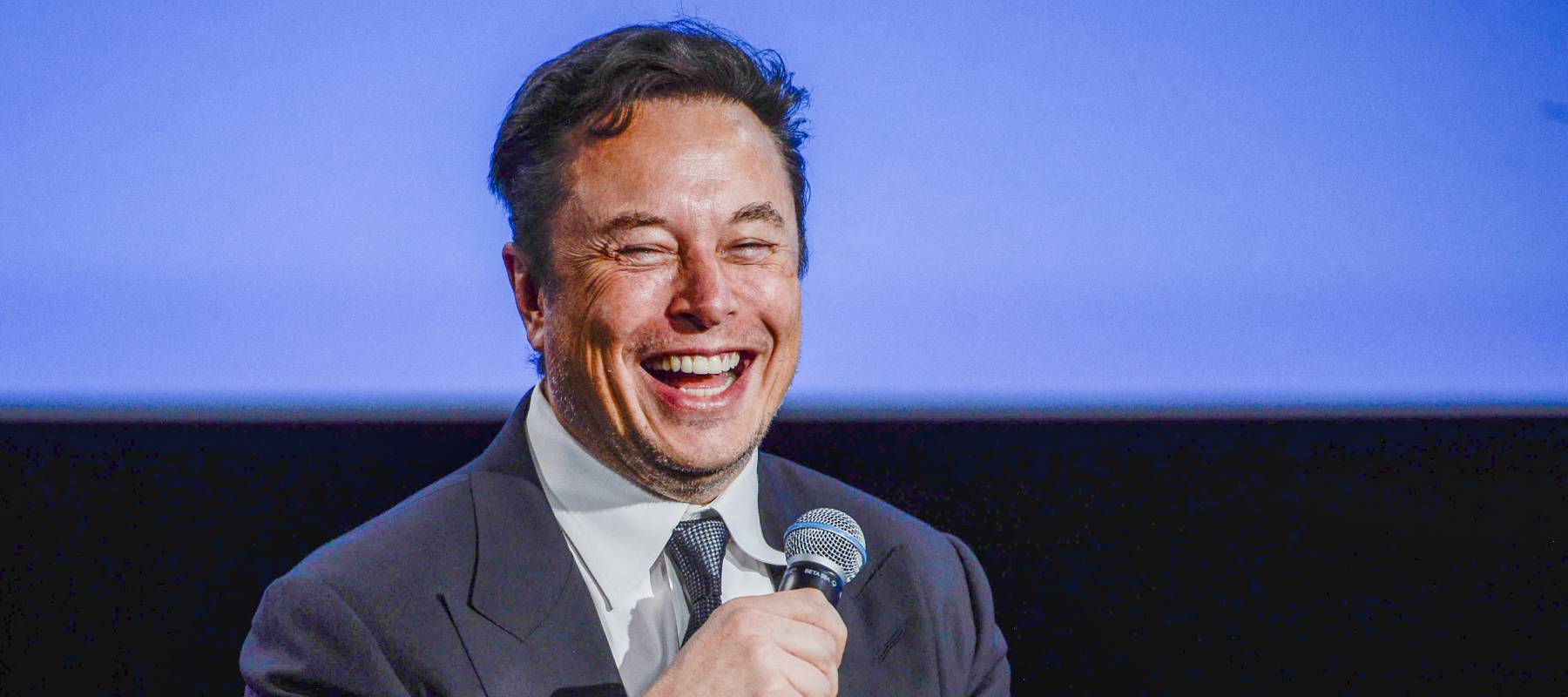Tesla CEO Elon Musk smiles as he addresses guests at the Offshore Northern Seas 2022 meeting in Stavanger, Norway on August 29, 2022.