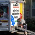 Man locks up a U-Haul truck.