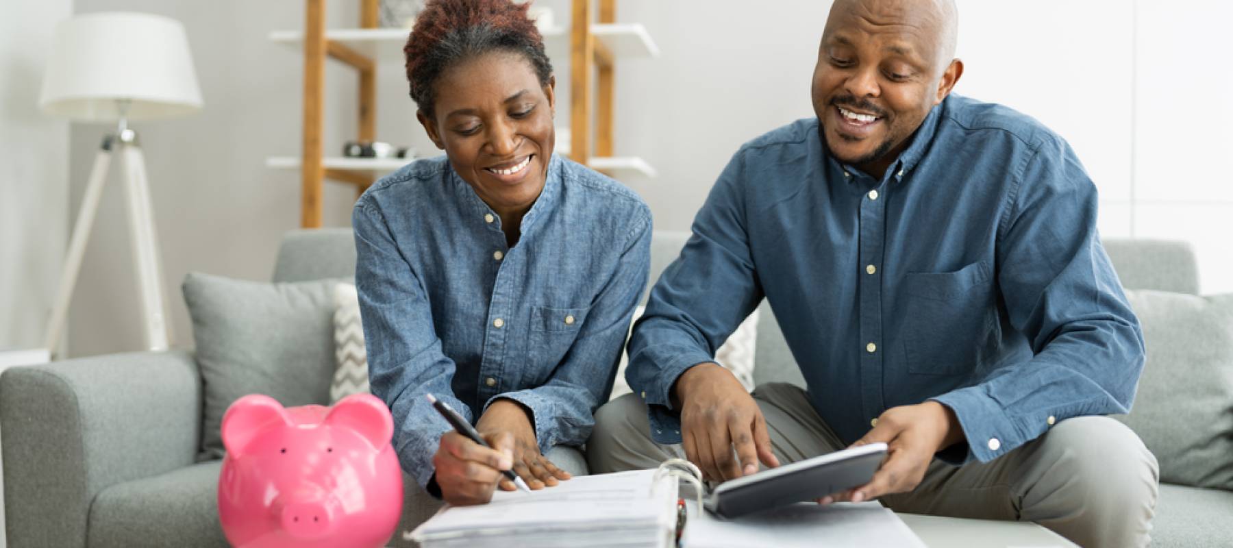 Happy African Couple Doing Retire Finances Plan And Money Budget