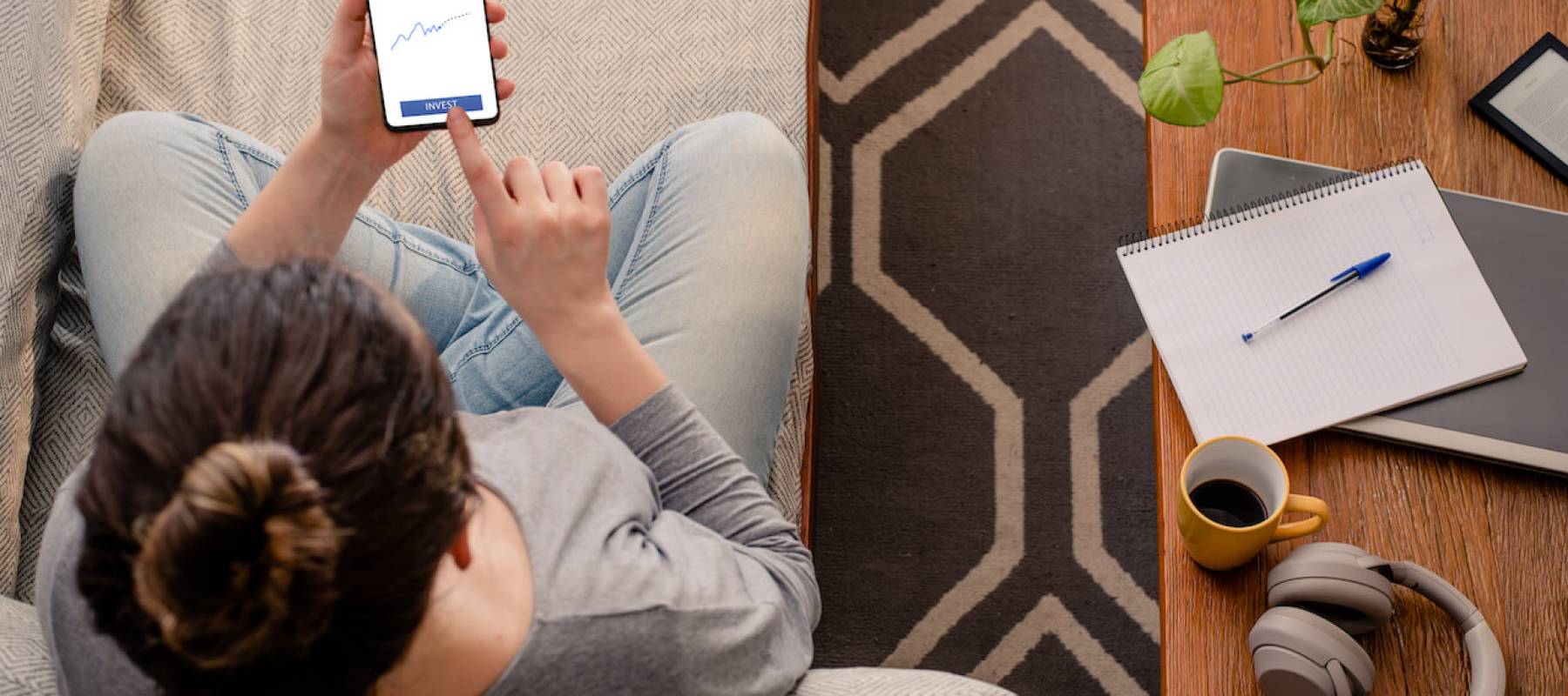 Woman on mobile phone while sitting on couch