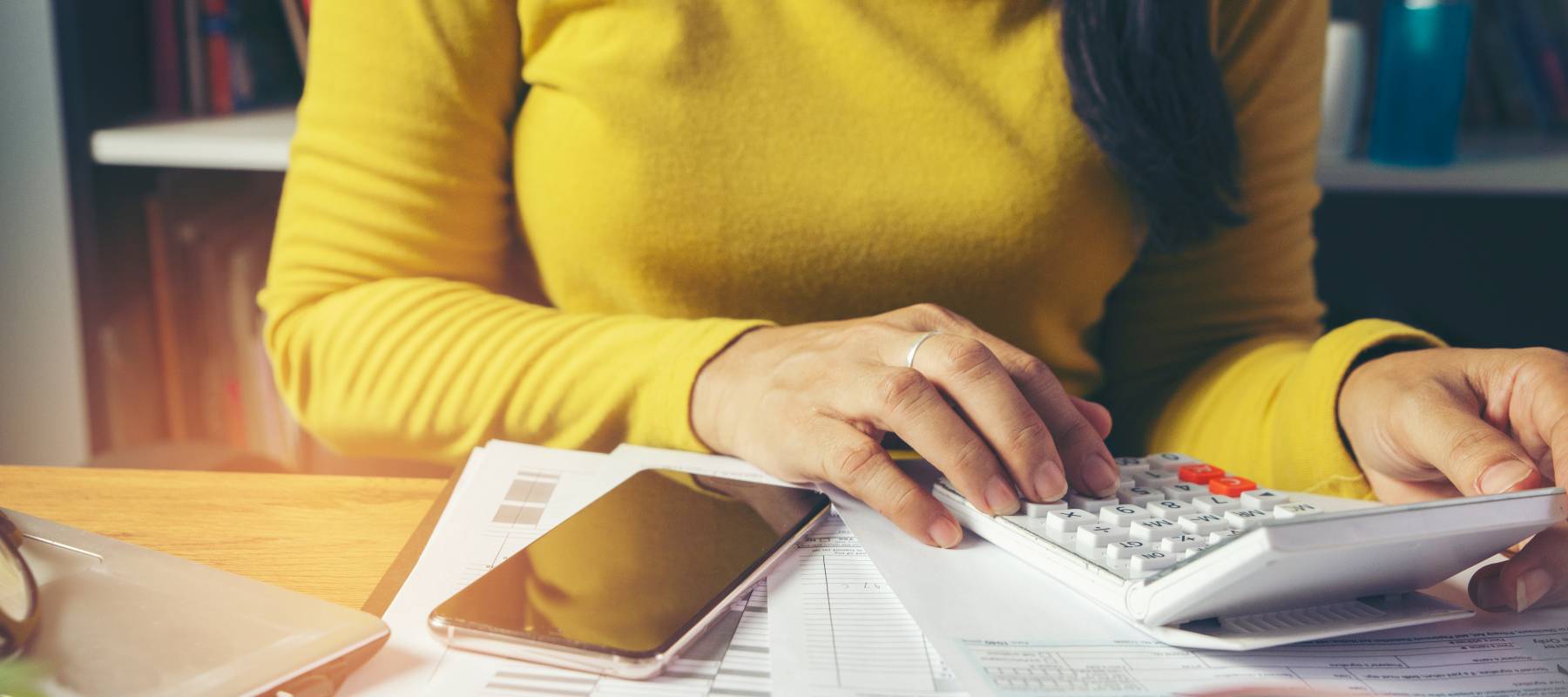 Tax Budget plan concept. Season to pay tax, Accountant calculate refund tax and using mobile phone to work online and report data