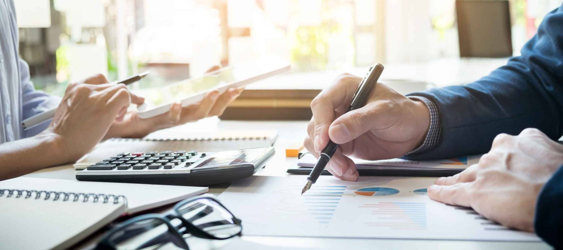 Administrator business man financial inspector and secretary making report, calculating balance. Internal Revenue Service checking document. Audit concept