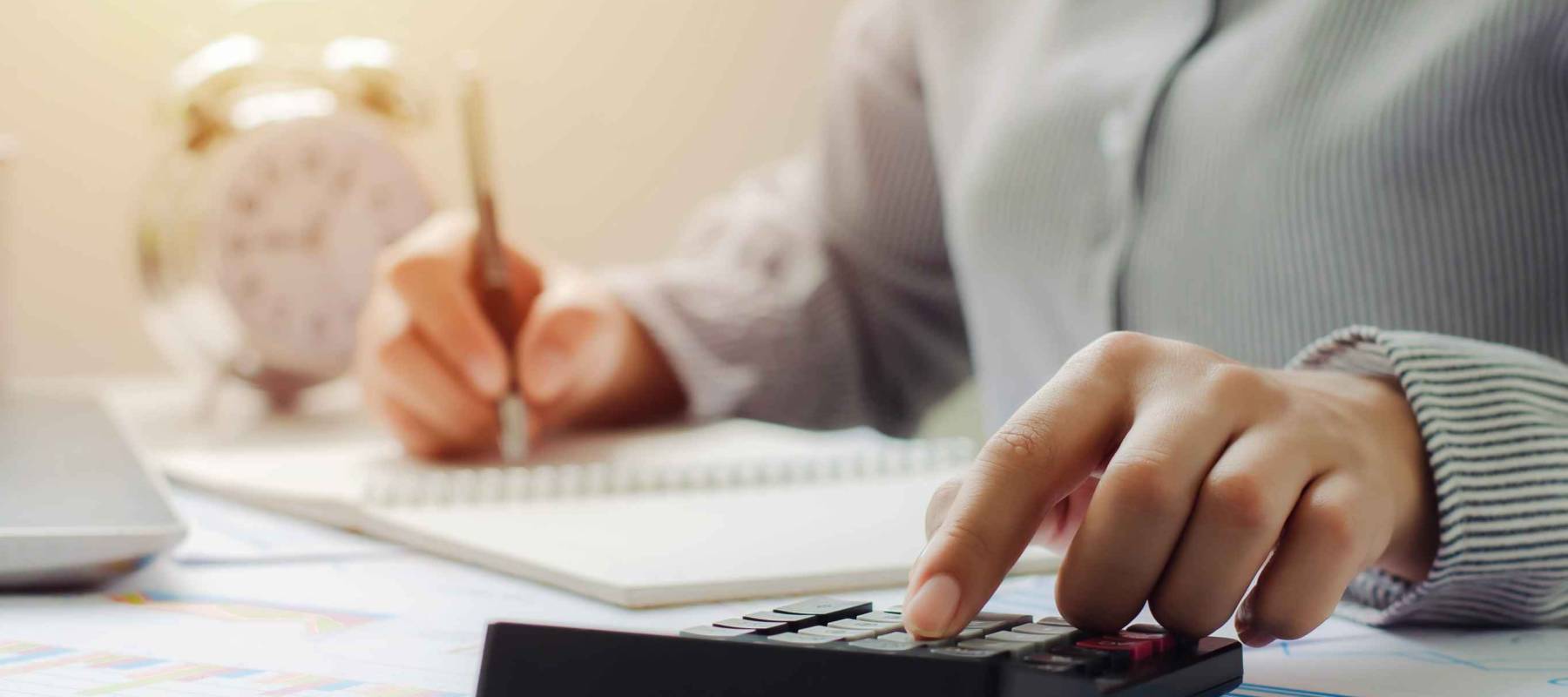 business woman in tax deduction planning concept Calculate tax deduction in 2022, businessman calculates business balance, prepares for tax deduction.