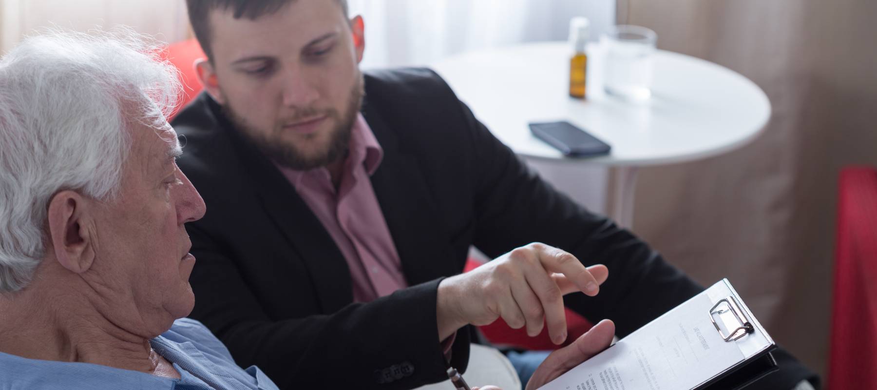 Terminally ill senior signing last will and testament