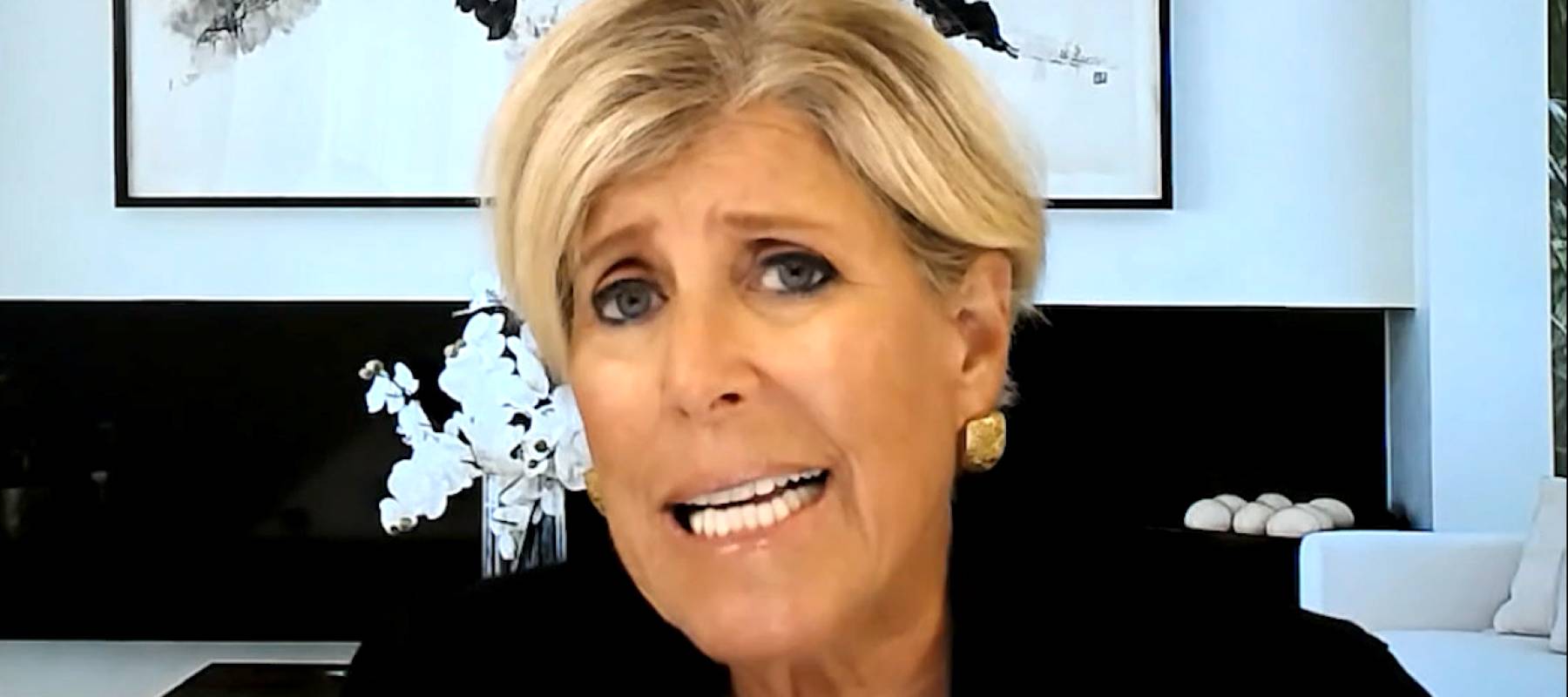 Suze Orman speaking during a video interview.