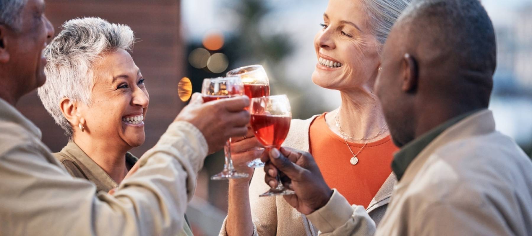 Friends, senior people with wine and retirement party, cheers and glasses with happiness, celebration and fun outdoor.