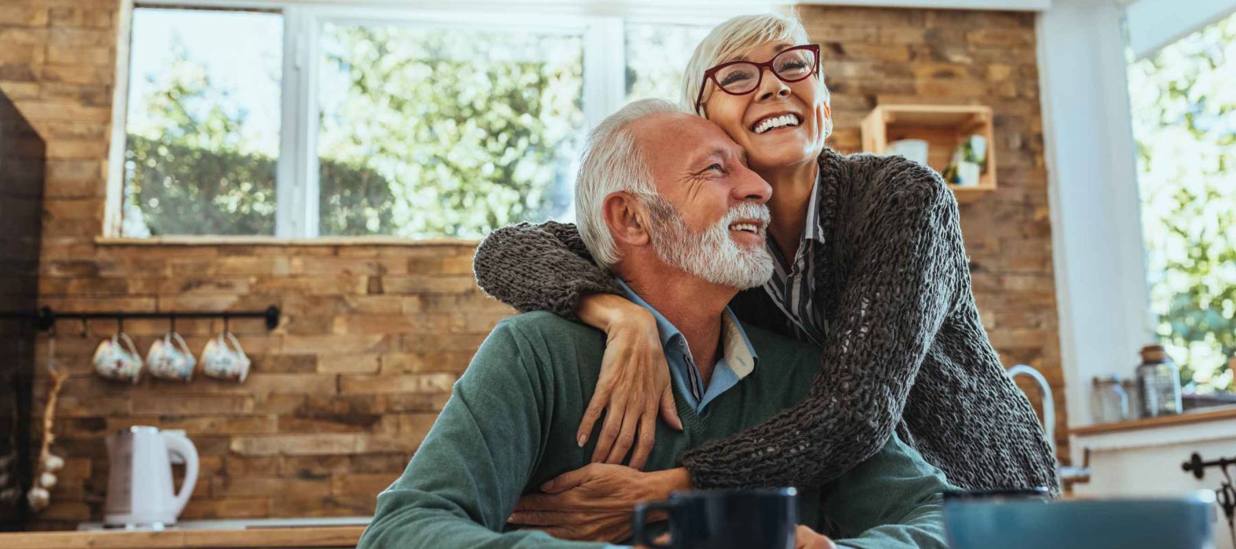Mature woman hugging her husband