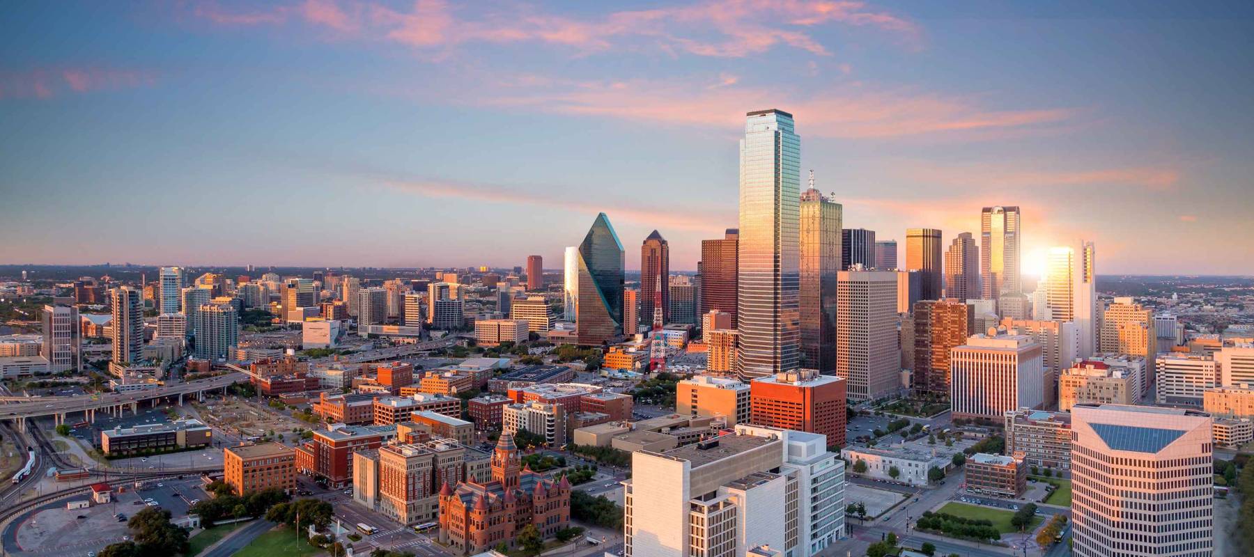 Dallas, Texas cityscape with blue sky at sunset, Texas
