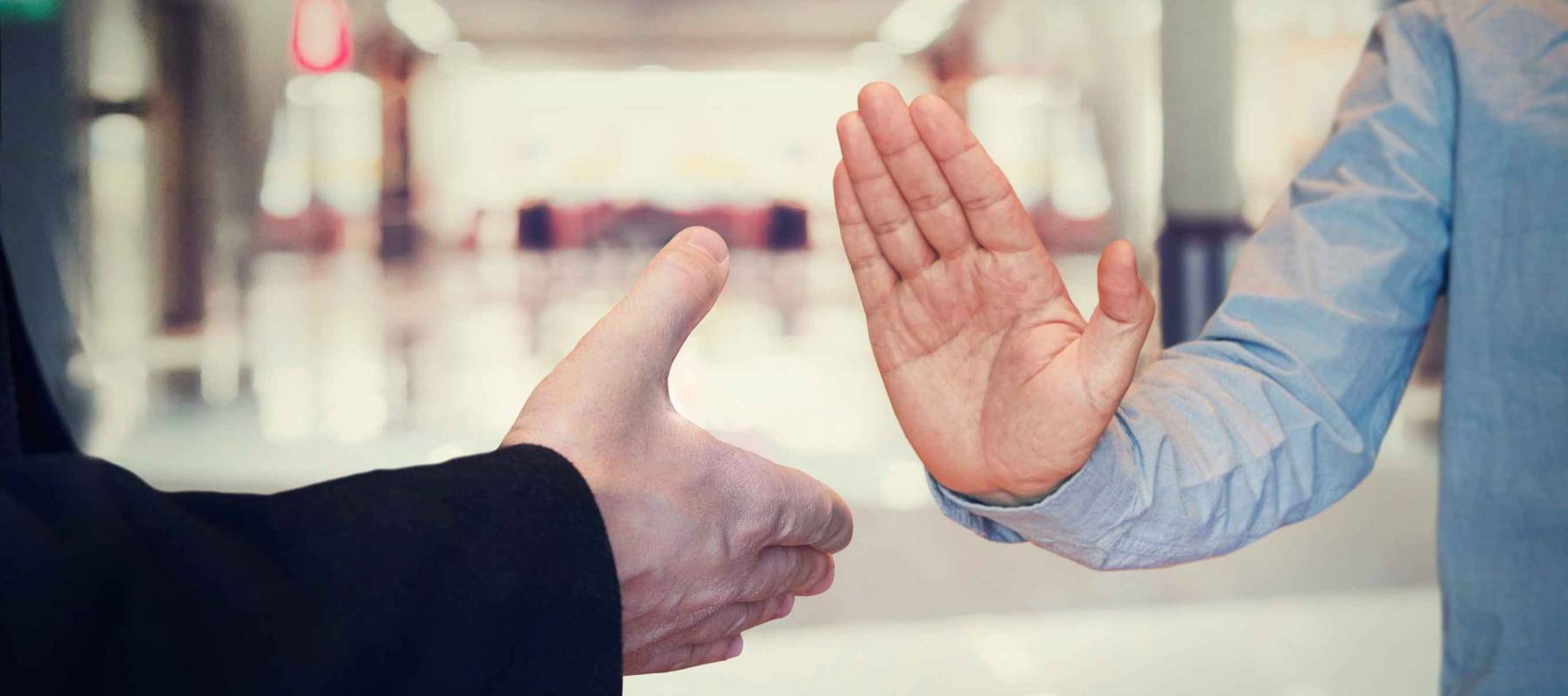 man refusing hand shake