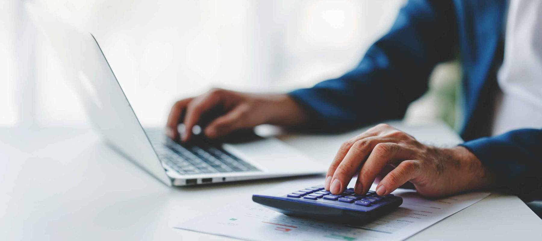 Close-up of business people working on taxes, financial accounting calculations, brokerage, copy space