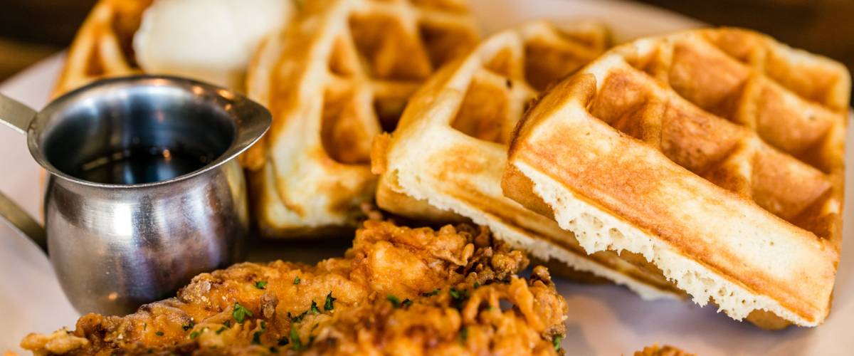 Fried chicken and waffles with syrup.