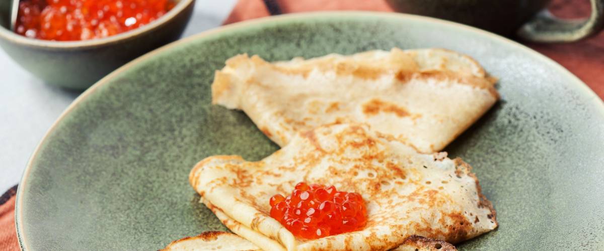 Sourdough pancakes with red salmon caviar traditional for Russian pancake week