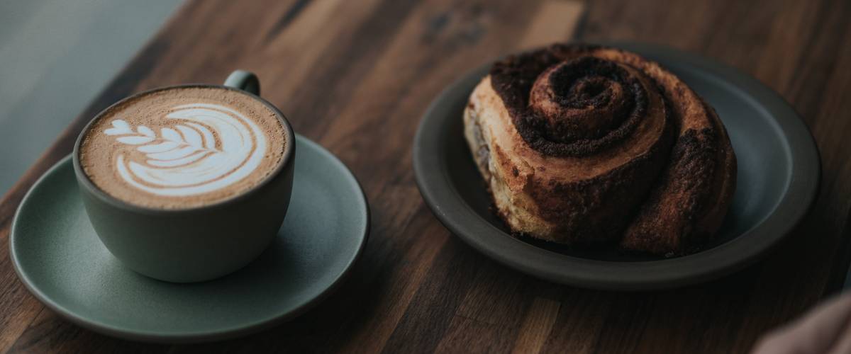 Latte and a cinnamon roll.