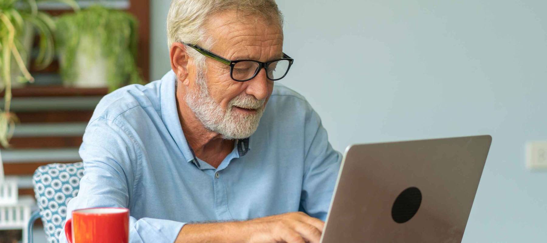Portrait senior man using laptop for working at home, Freelance concept - Image
