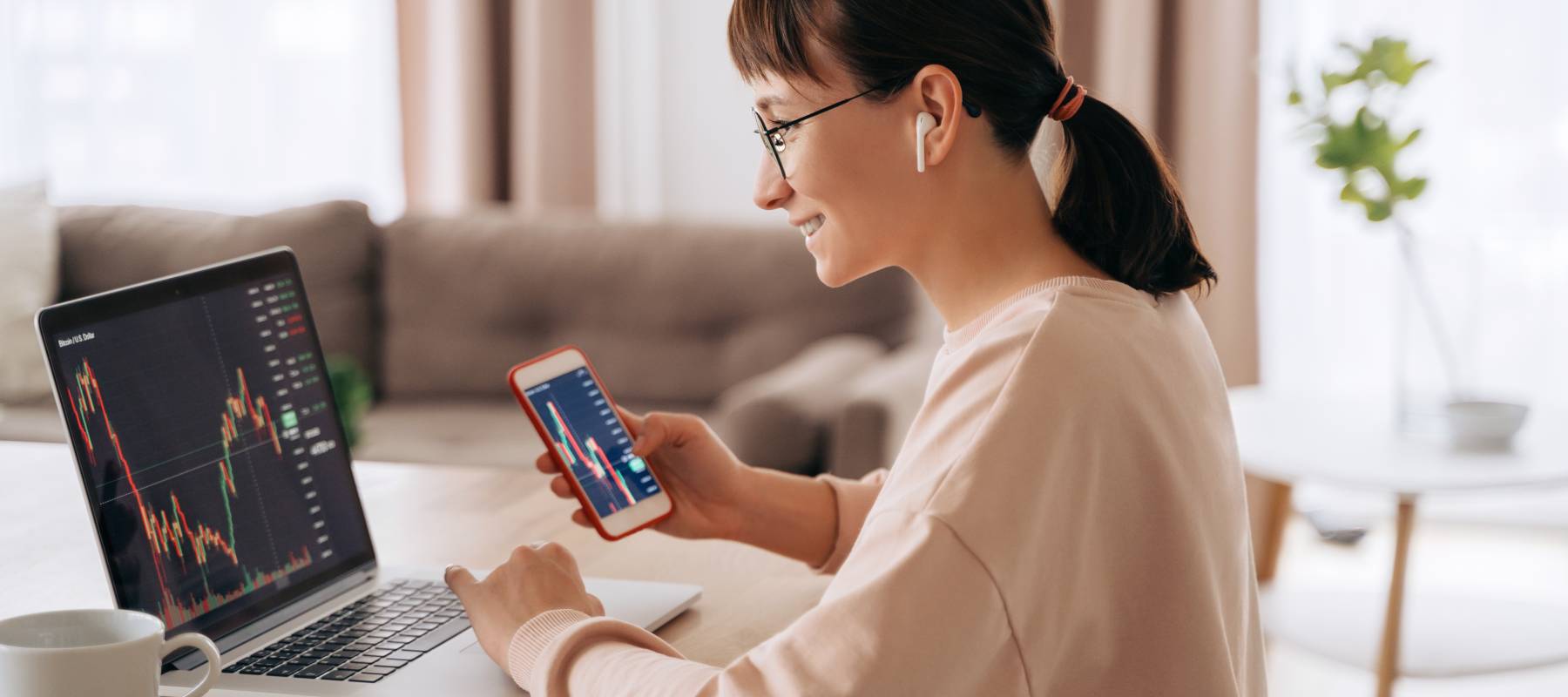 Young woman stock trading at her desk.