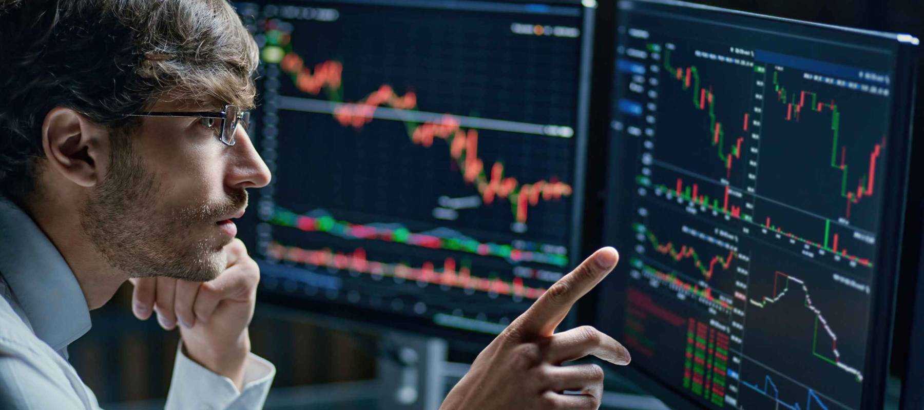 businessman comparing stock market data late in the evening .