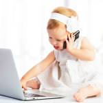 baby girl with computer laptop and mobile phone