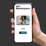 Hand holds smartphone with type of cryptographic NFT marketplace with art sale