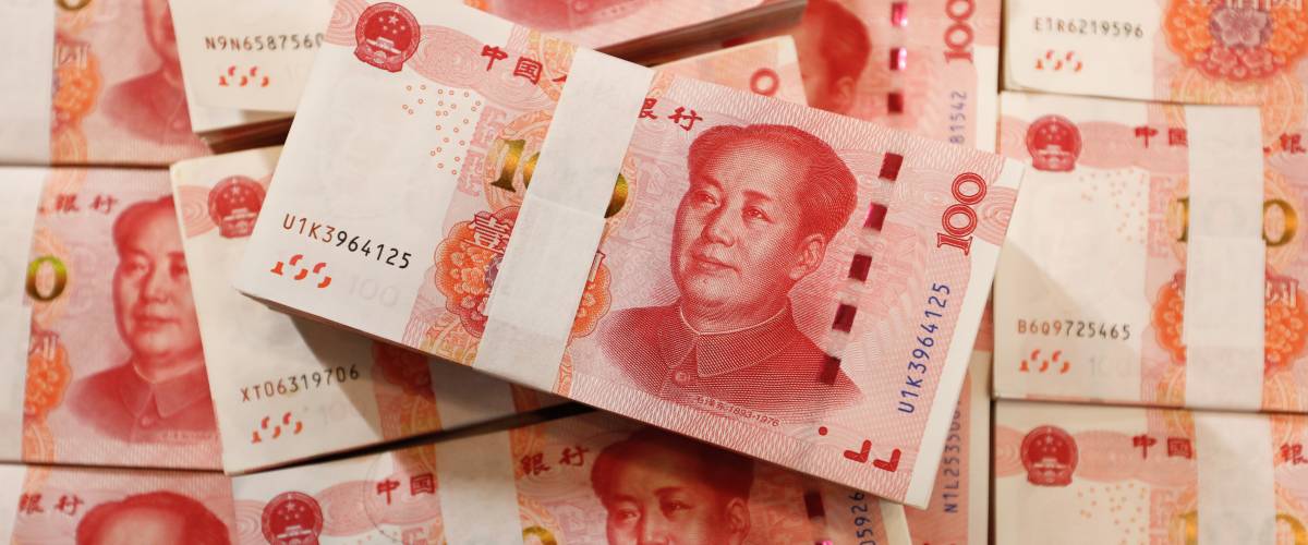 Bundles of Renminbi. Chairman MAO zedong's portrait on the background of 100 Yuan, Chinese banknotes, RMB banknotes.
