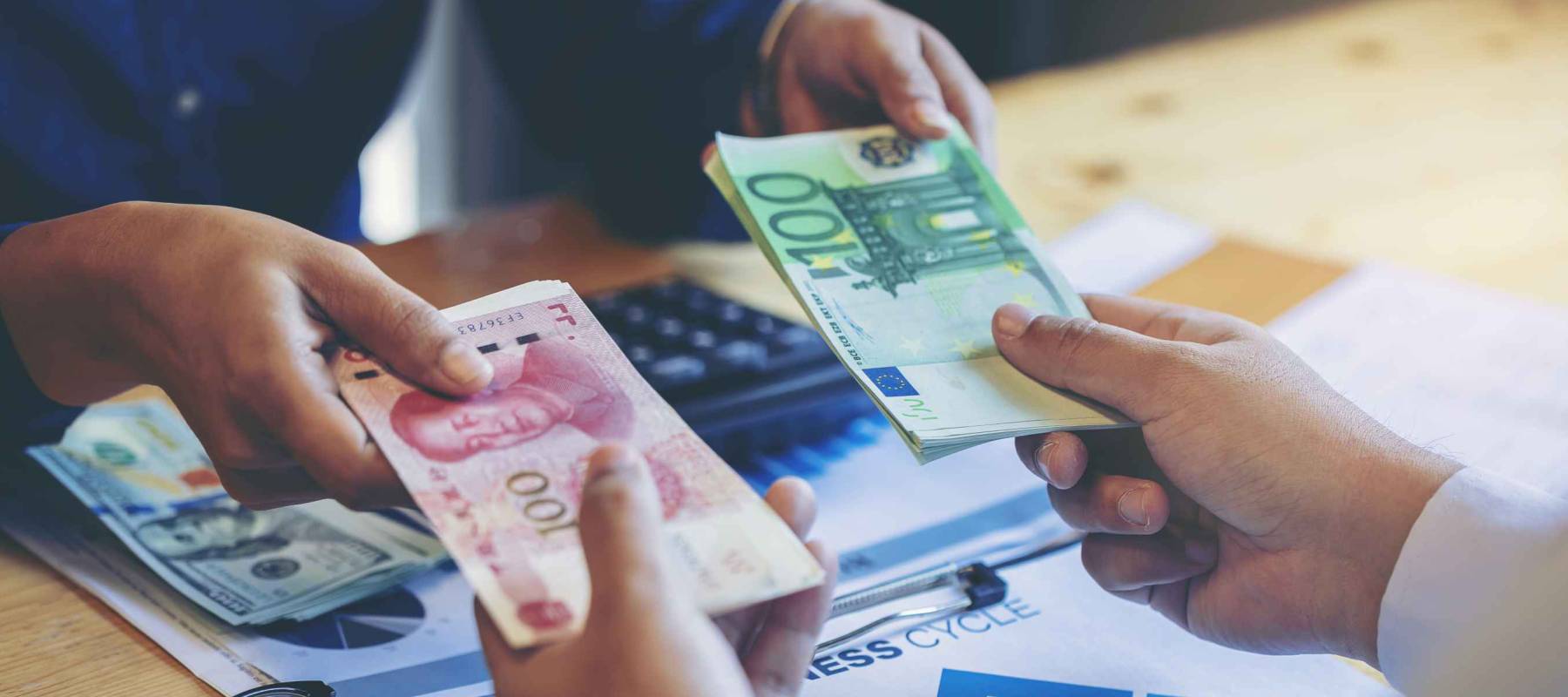 Exchange money, Business peoople exchange Chinese money (Yuan) for Euro money. Business exchange and investment concept