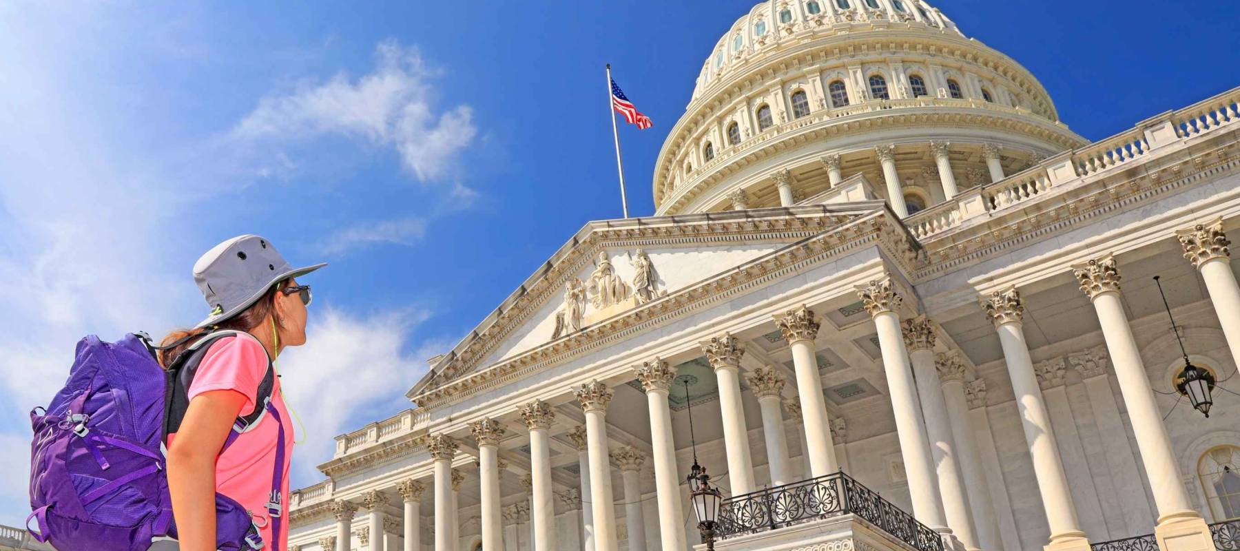 Young girl tourist admiring the US Capitol in Washington DC, USA