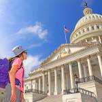 Young girl tourist admiring the US Capitol in Washington DC, USA
