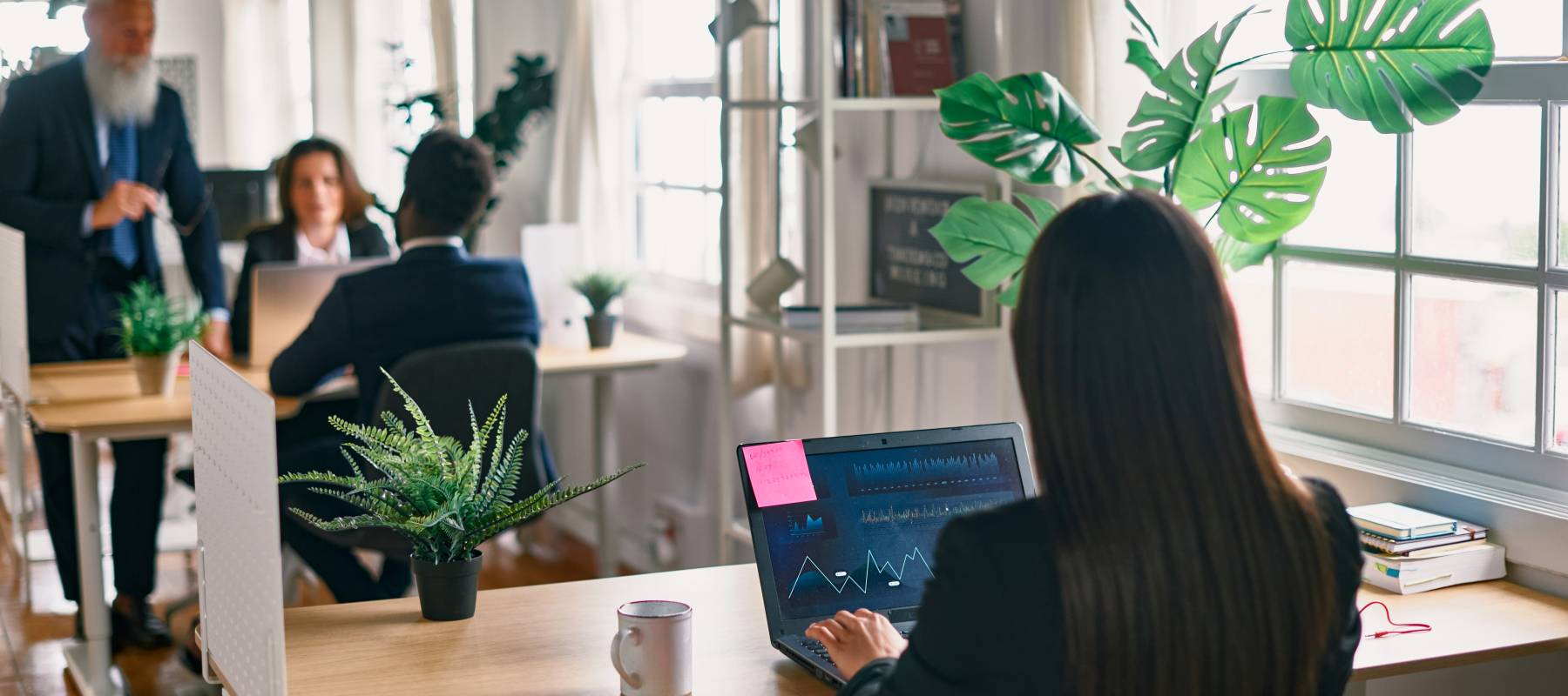 Multiracial business people working inside hedge fund office - Focus on screen