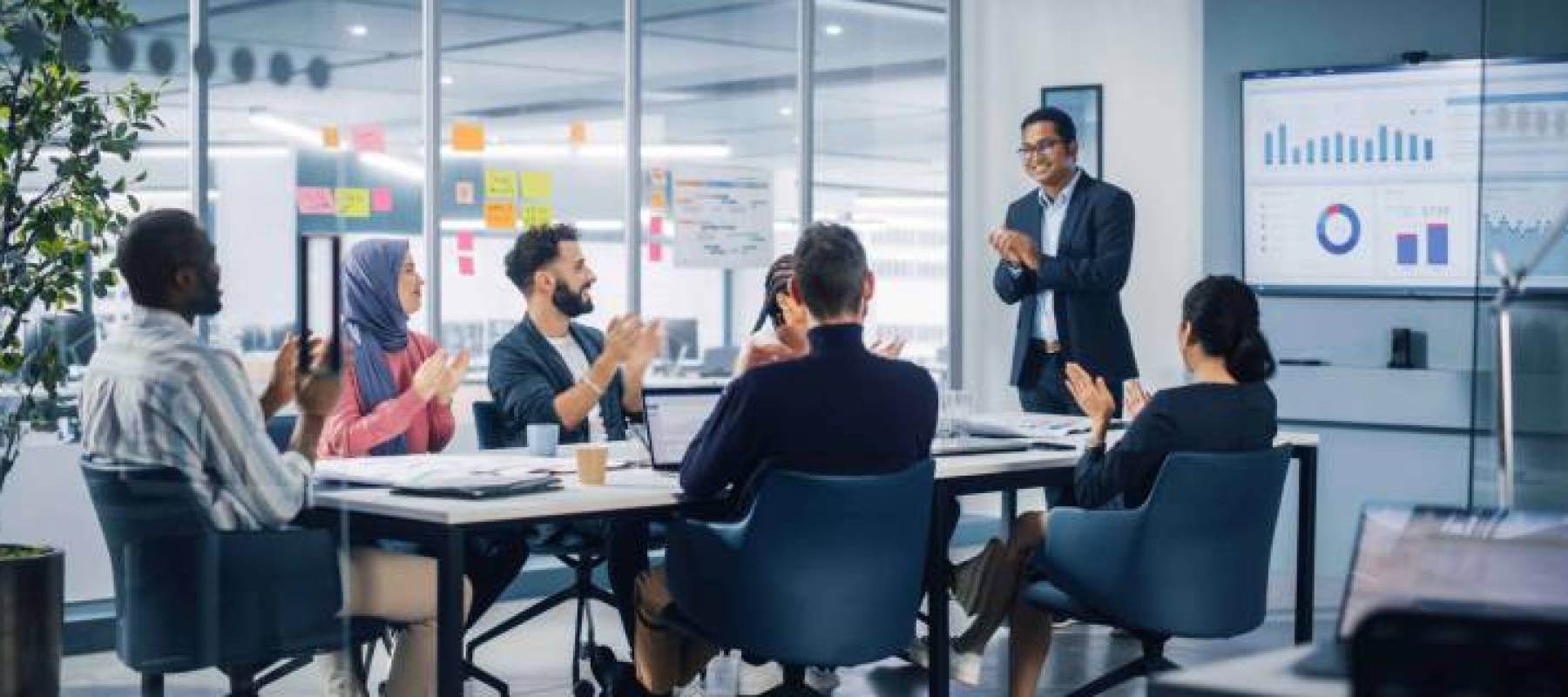Multi-Ethnic Office Conference Room. Indian CEO does Presentation for Diverse Young Entrepreneurs,