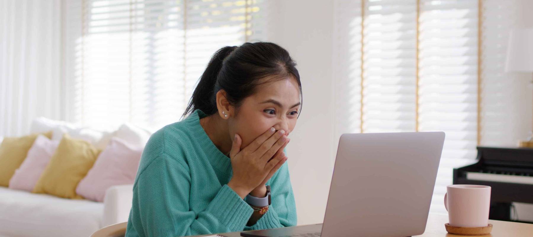 Asia people teen girl young worker workforce work at home office on table happy joy laugh smile with good news of job hired result on laptop