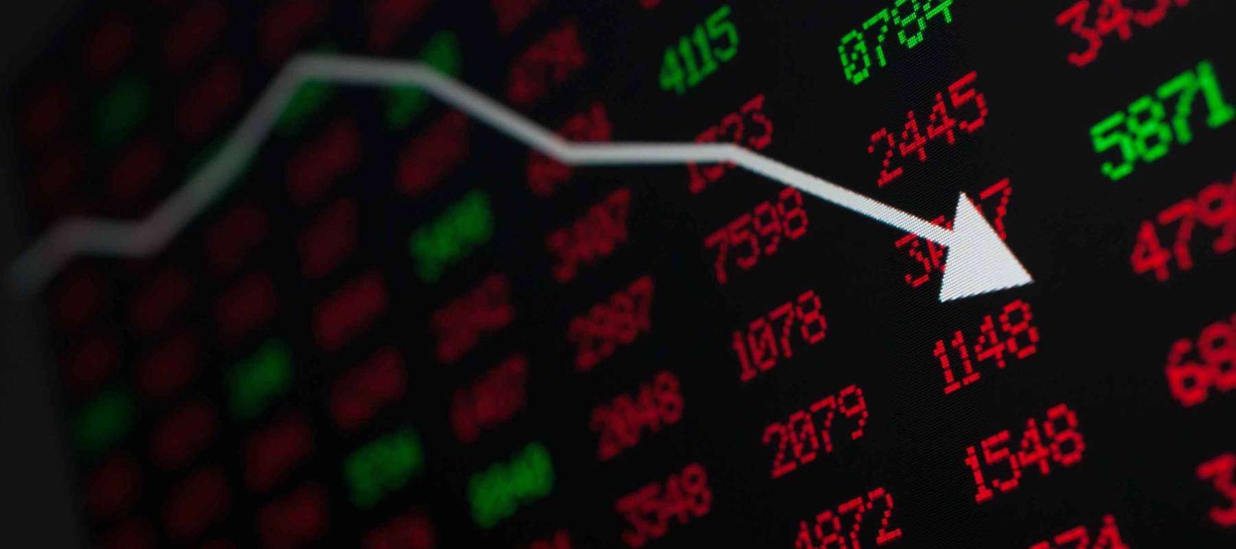 Stock Market - Arrow Graph Going Down on Display With Red and Green Figures