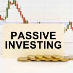 Business concept. Against the background of the quotes chart, a business card with the inscription - Passive Investing