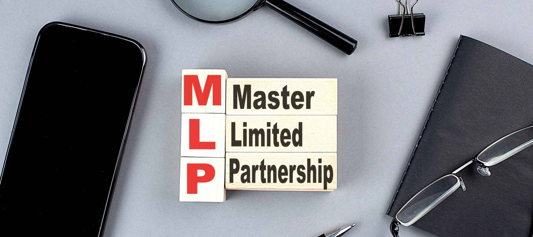 wooden cubes MLP wtih notebook , magnifier and smartphone, business