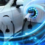 EV Car or Electric vehicle at charging station with the power cable supply plugged in.