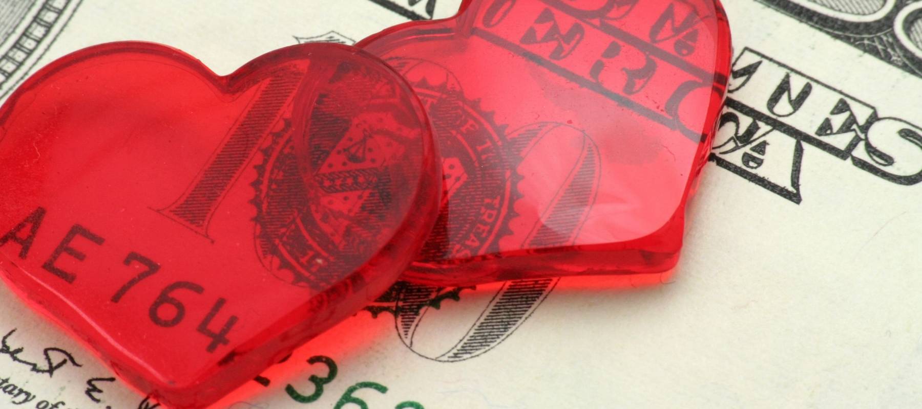 red heart and dollar, love concept, close up