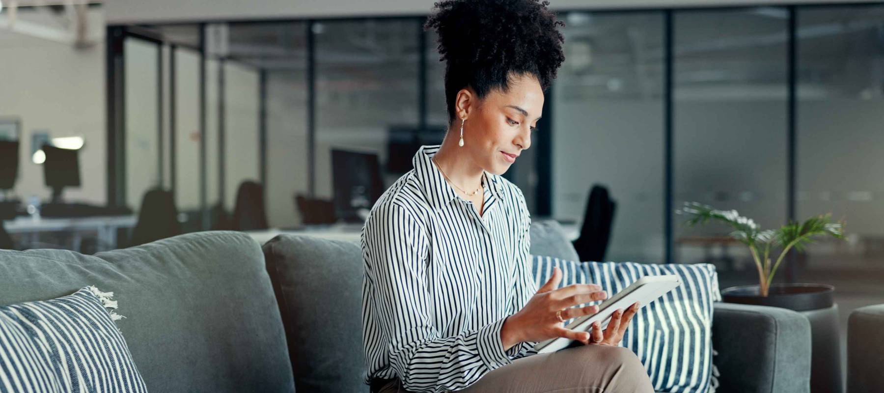 Tablet, business lounge or black woman typing feedback review of finance portfolio