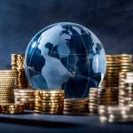 Globe and stack with coins. Money makes the world go round