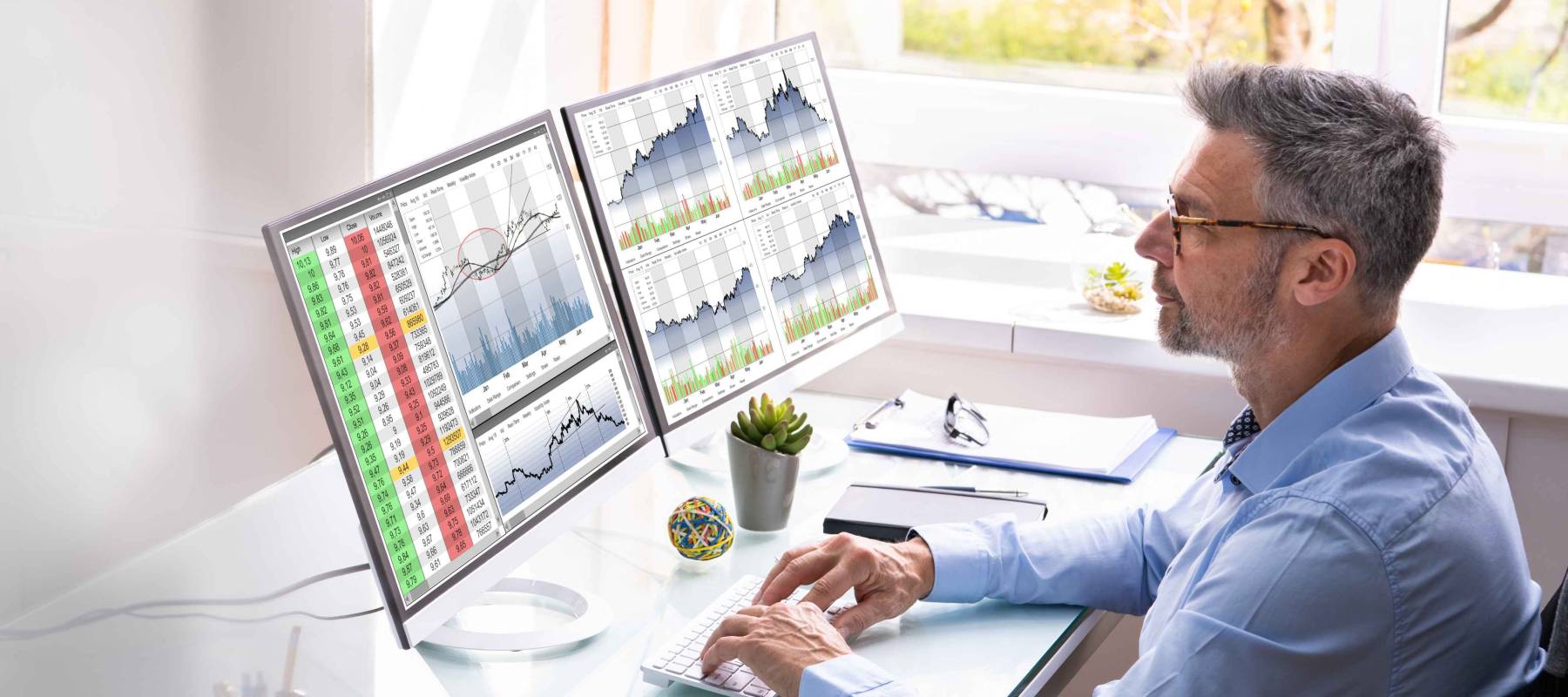Stock Exchange Analyst Using Multiple Computer Screens
