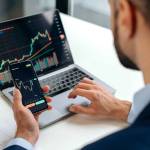Close-up of male hands holding smartphone. Trader investor analyst using mobile phone app for cryptocurrency stock market, analyzing graph showing growth