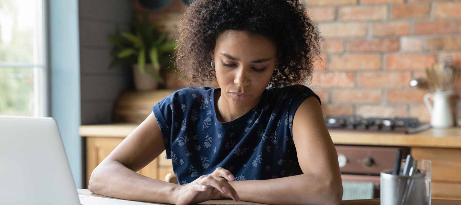 Serious mixed race female calculate utility charges check payments sum by loan contract to avoid scam.