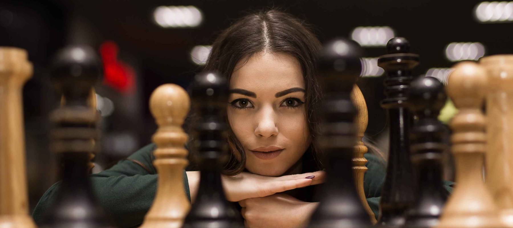 beautiful girl playing chess